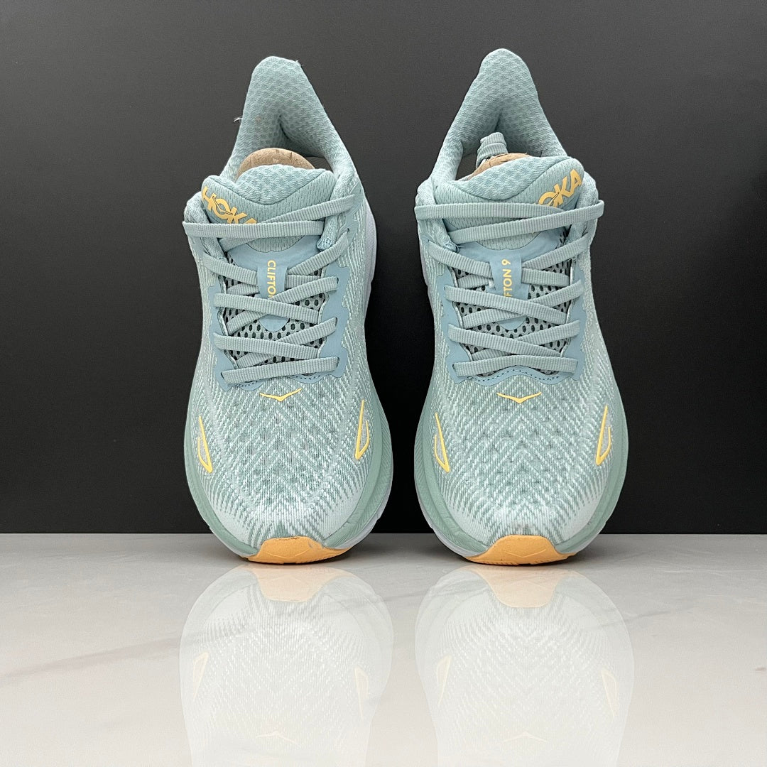 HOKA Clifton 9 Running Shoes in Mint and Yellow - product image from the listing.