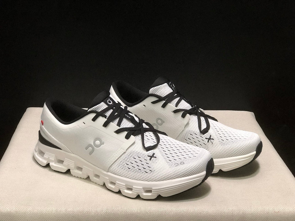 On Cloud X 4 Sneakers in Ivory and Black - product image from the listing.