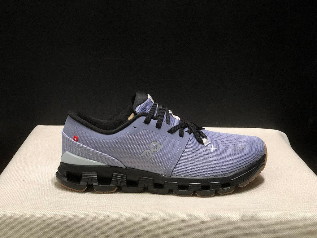 On Cloud X 4 Sneakers in Feather in Black - product image from the listing.