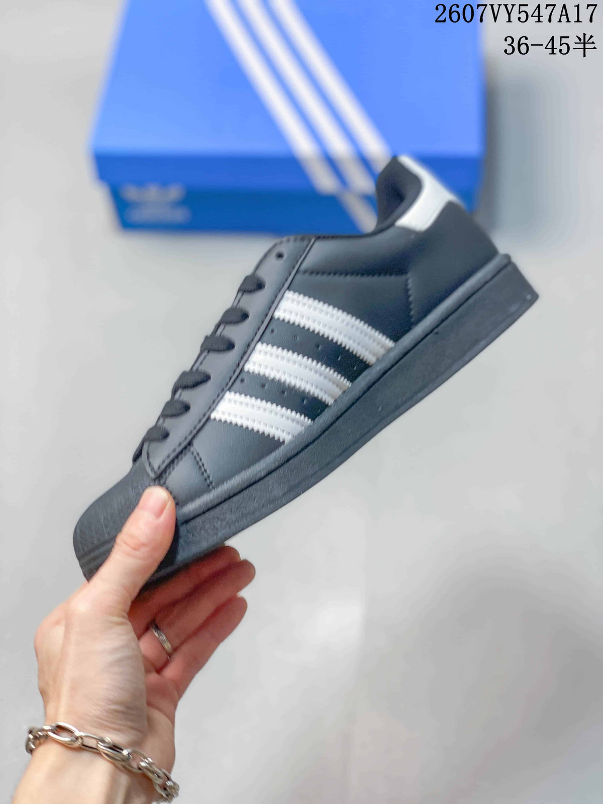 Adidas Originals Superstar Sneakers in Black and White - product image from the listing.