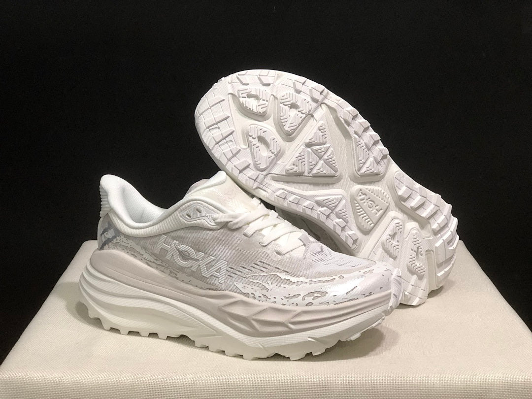 HOKA Stinson 7 Sneakers in White and Gray - product image from the listing.
