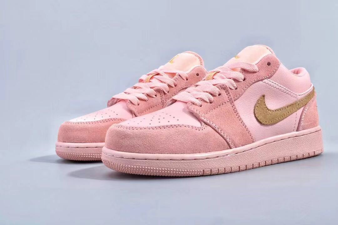 Women's Jordan 1 Low Pink and Gold Sneakers - product image from the listing.