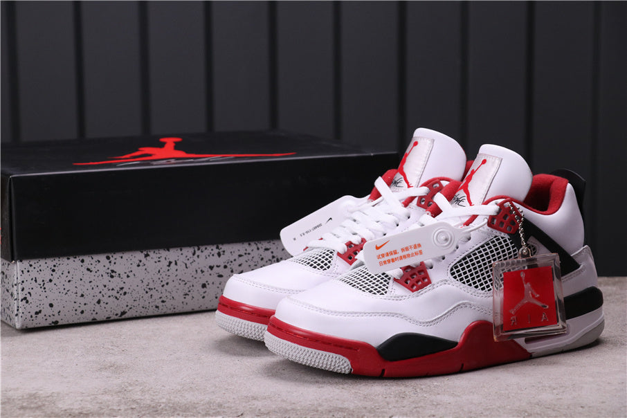 Air Jordan 4 Retro White Red Black Sneakers - product image from the listing.