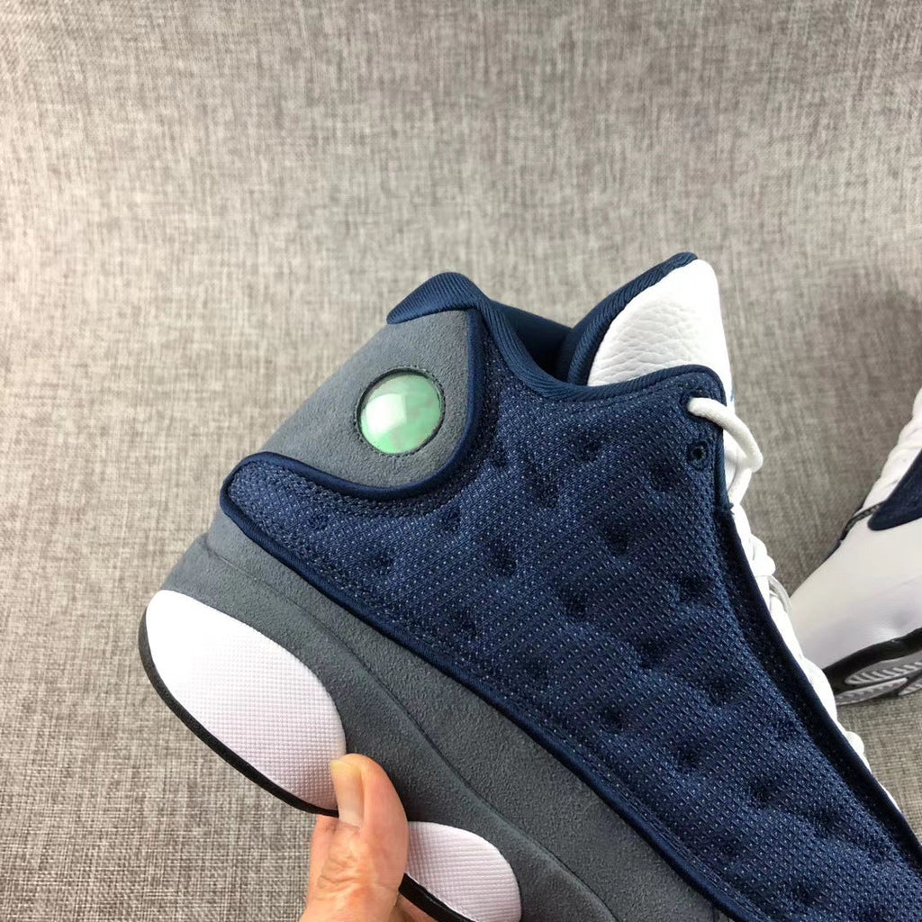 Air Jordan 13 Flint Navy Sneakers 414571-404 - product image from the listing.
