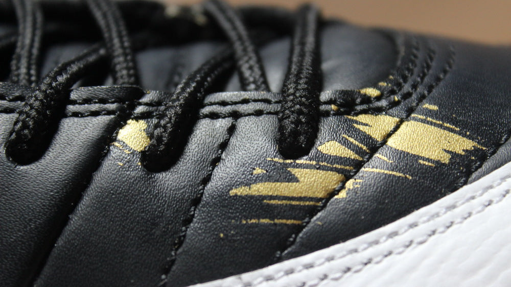 Air Jordan 12 Wings Black White Gold Sneakers 848692-033 - product image from the listing.