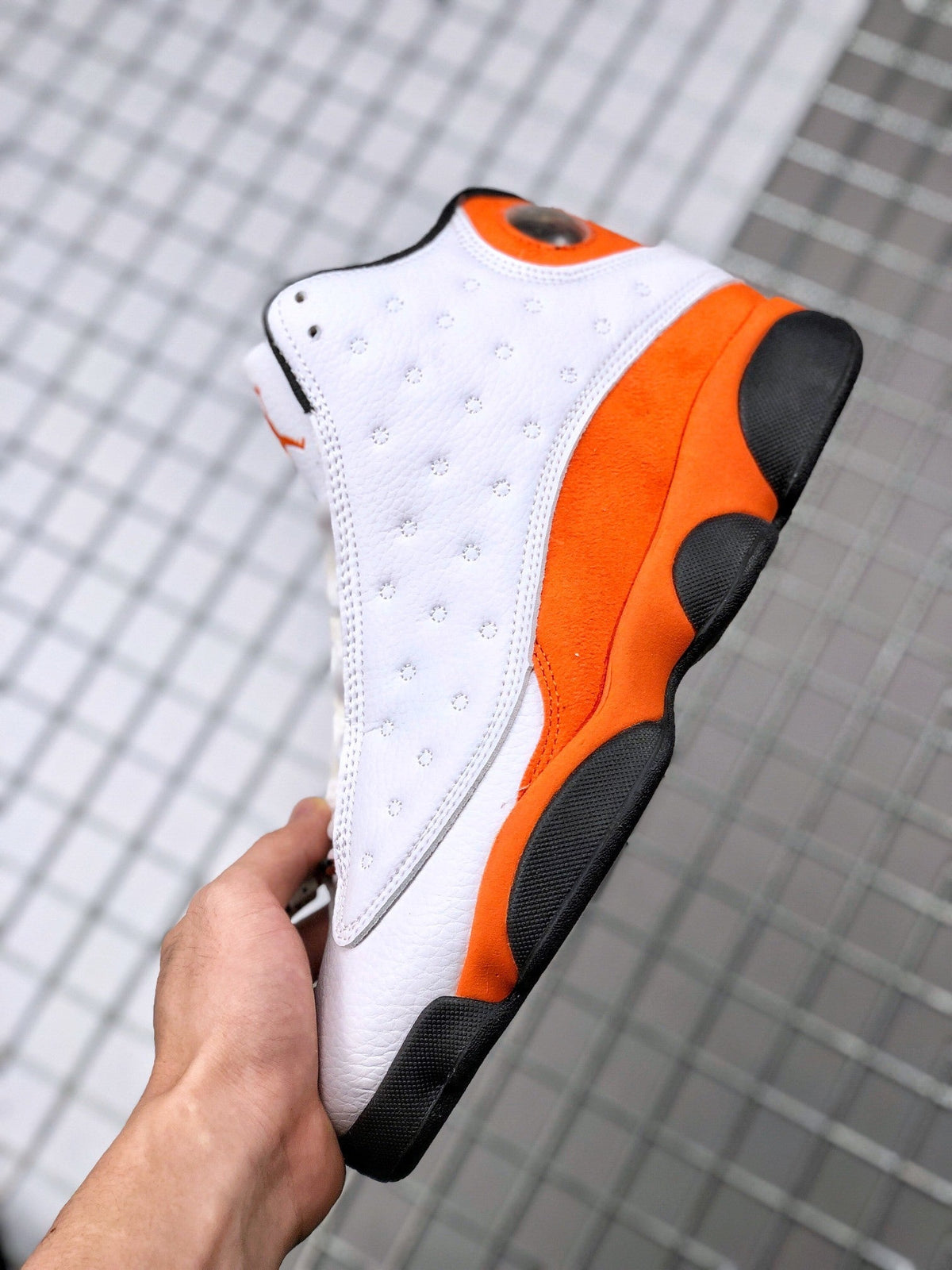 Air Jordan 13 Starfish White Orange Sneakers 414571-108 - product image from the listing.