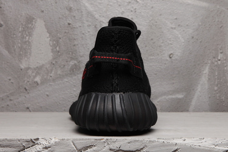 adidas Yeezy Boost 350 V2 Sneakers in Black - product image from the listing.