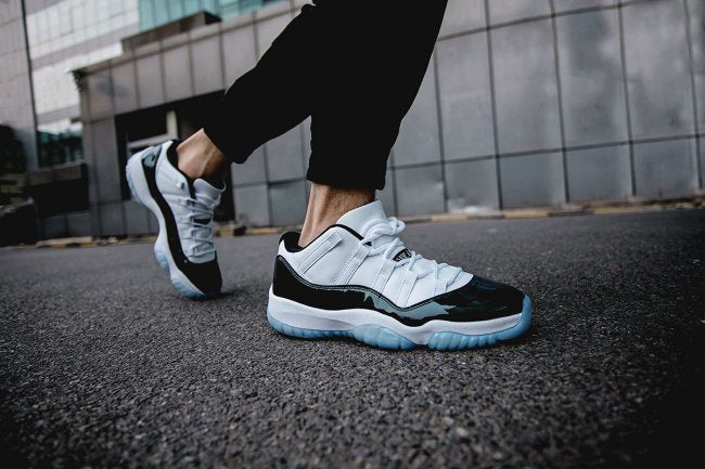 White and Black Air Jordan 11 Iridescent Sneakers - product image from the listing.