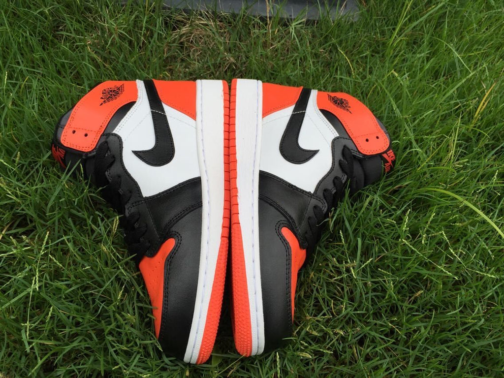 Women's Jordan 1 High Black Orange White Sneakers - product image from the listing.