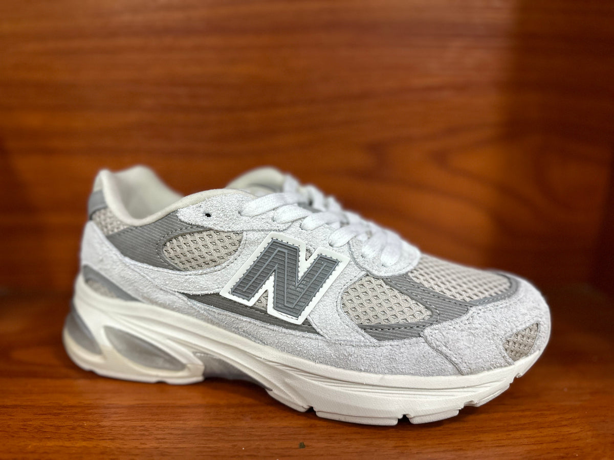 New Balance 530 Sneakers in Grey and White - product image from the listing.