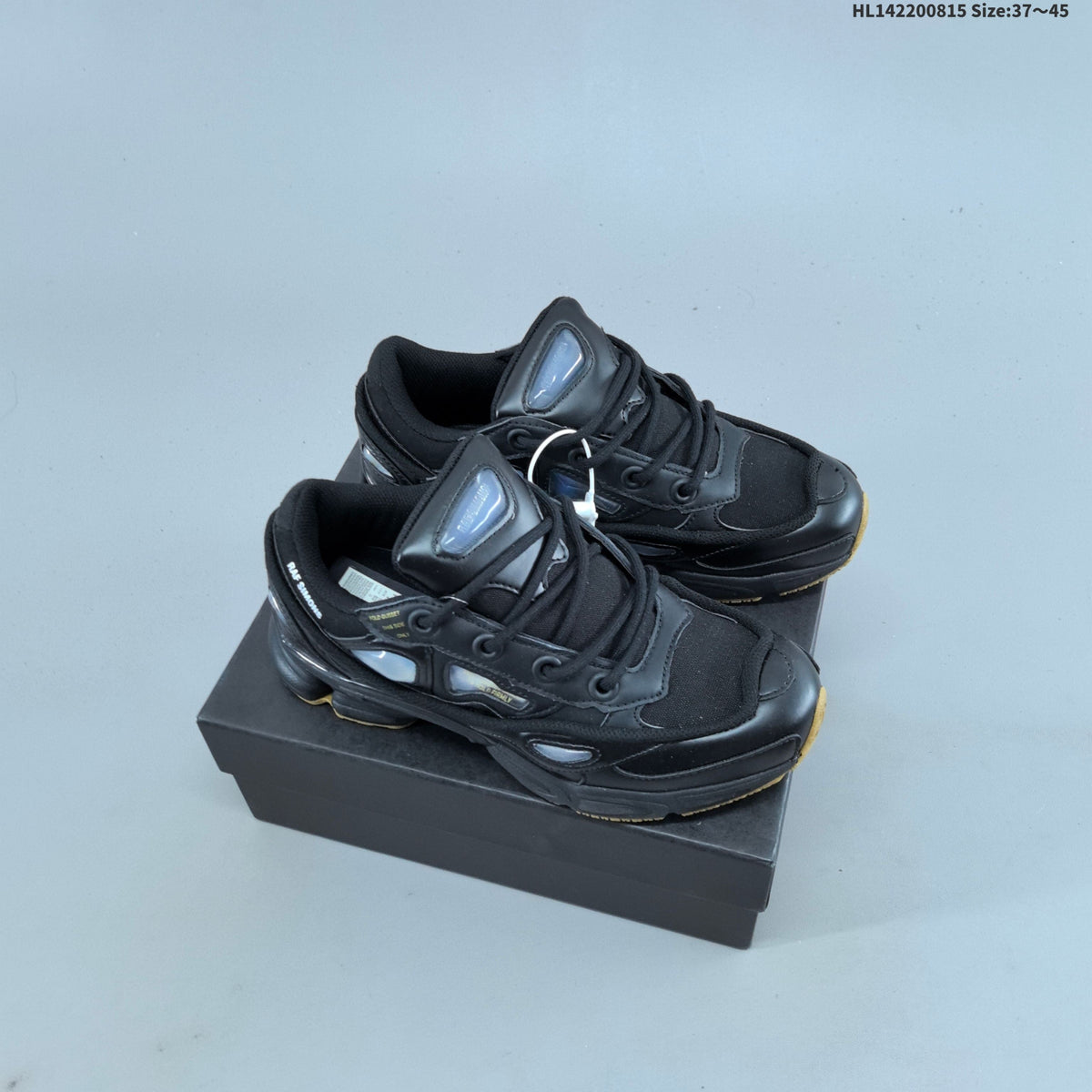 Raf Simons x adidas Ozweego III Retro Sneakers for Running - product image from the listing.
