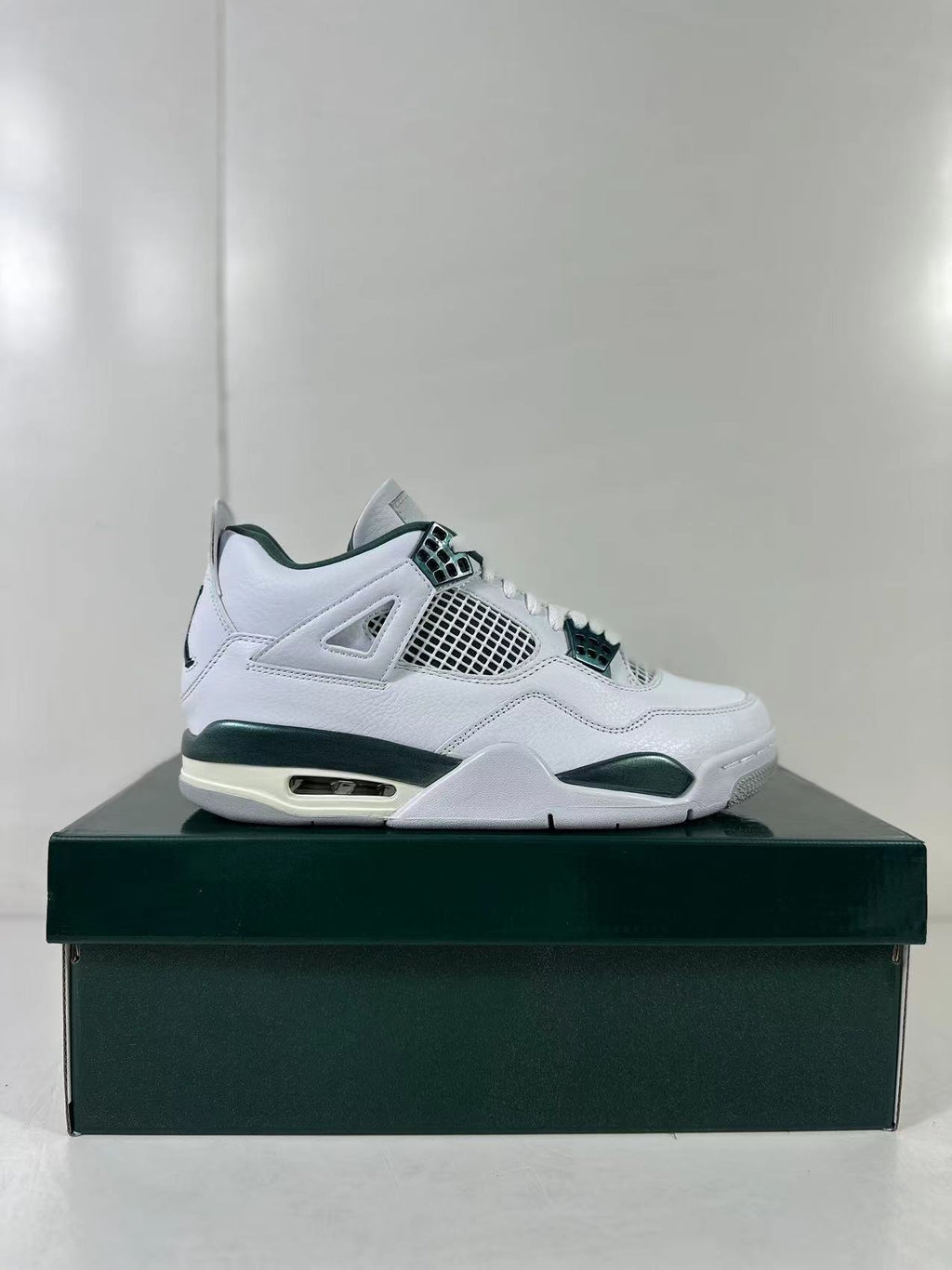 Air Jordan 4 Retro Bucks White Green Sneakers FQ8138-103 - product image from the listing.