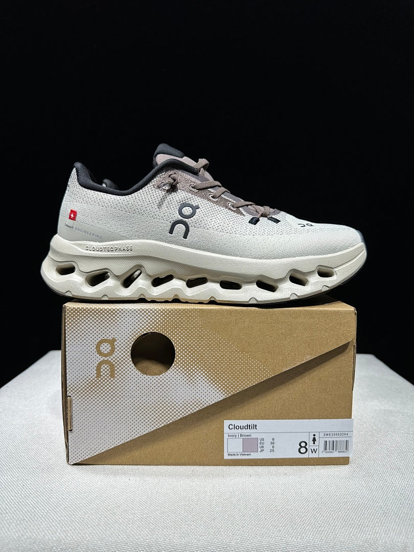 On Cloudtilt Sneakers, in Light Gray and Black - product image from the listing.