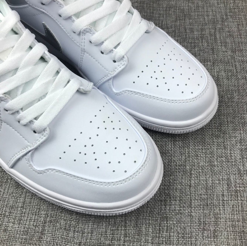 Air Jordan 1 Mid Sneakers in White Silver 554724-105 - product image from the listing.