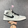Air Jordan 1 Mid High-Top Sneakers in Grey and Black - product image from the listing.