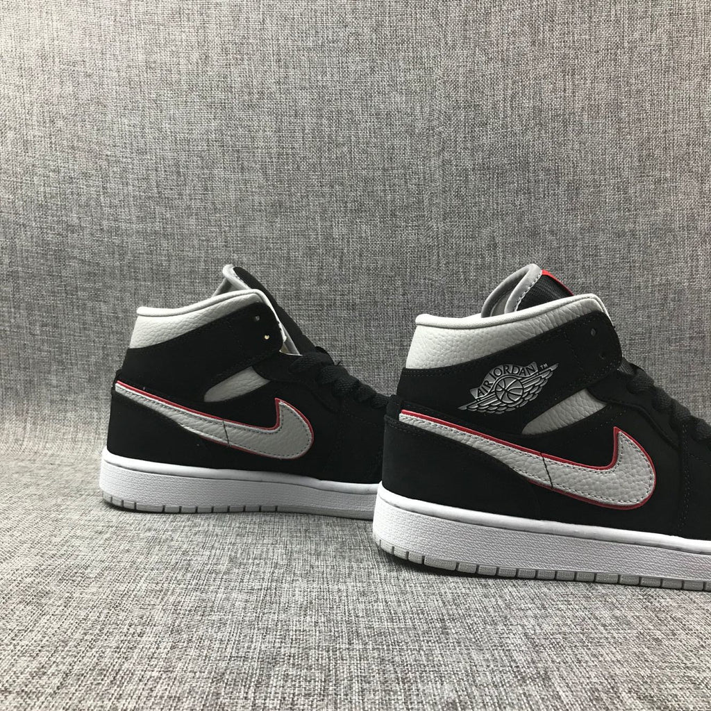 Air Jordan 1 Mid Black, Sneakers in White & Red 554724-060 - product image from the listing.