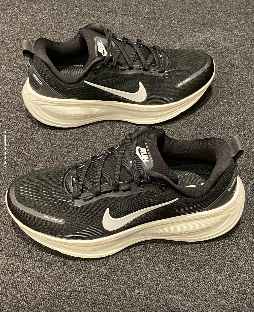 Nike Vomero 18 Running Shoes in Black White HM6803-007 - product image from the listing.