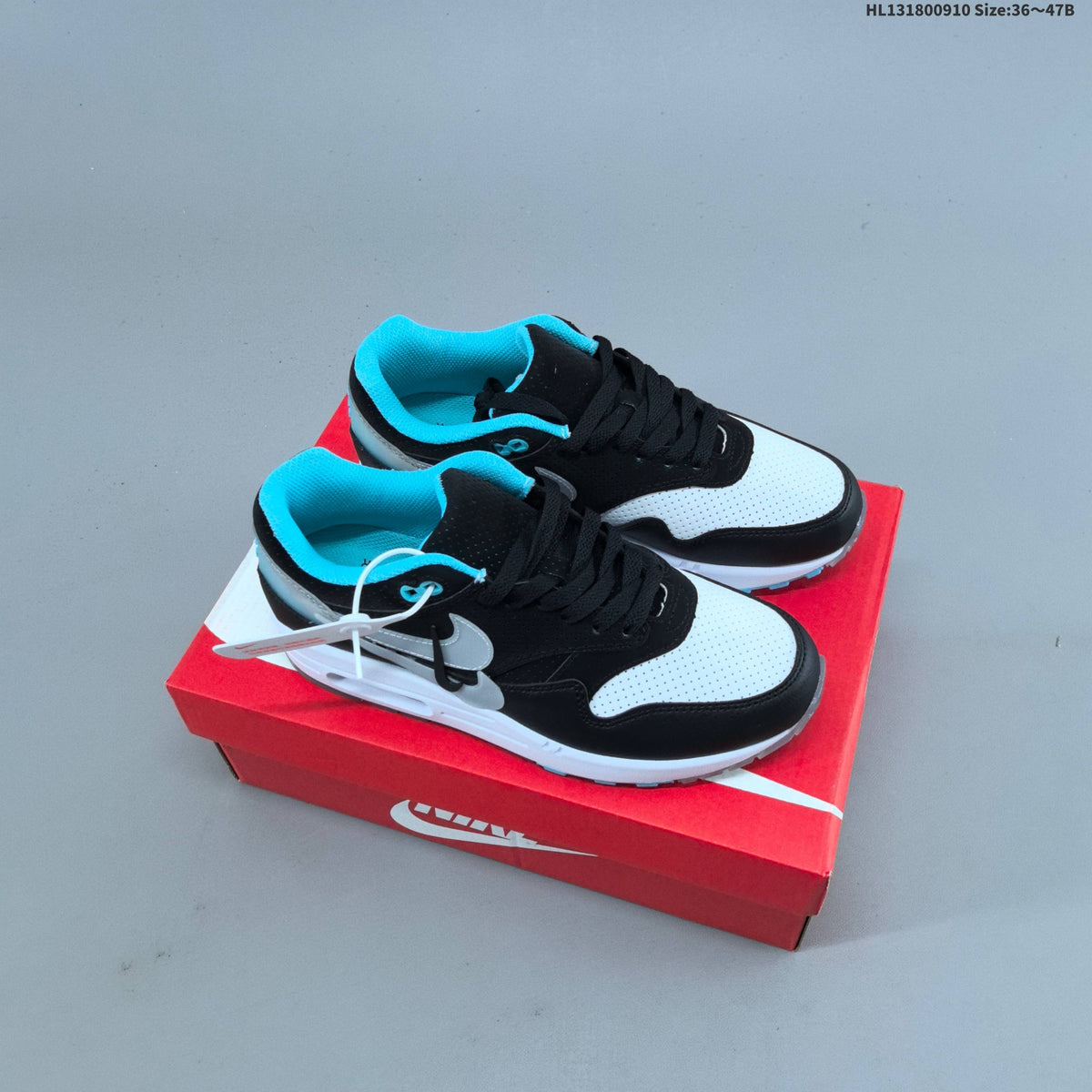 Nike Air Max 1 Sneakers in Black White and Turquoise - product image from the listing.