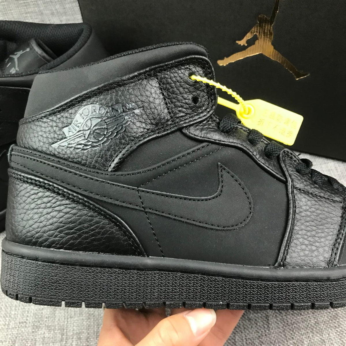 Air Jordan 1 Mid Sneakers, in Black - product image from the listing.