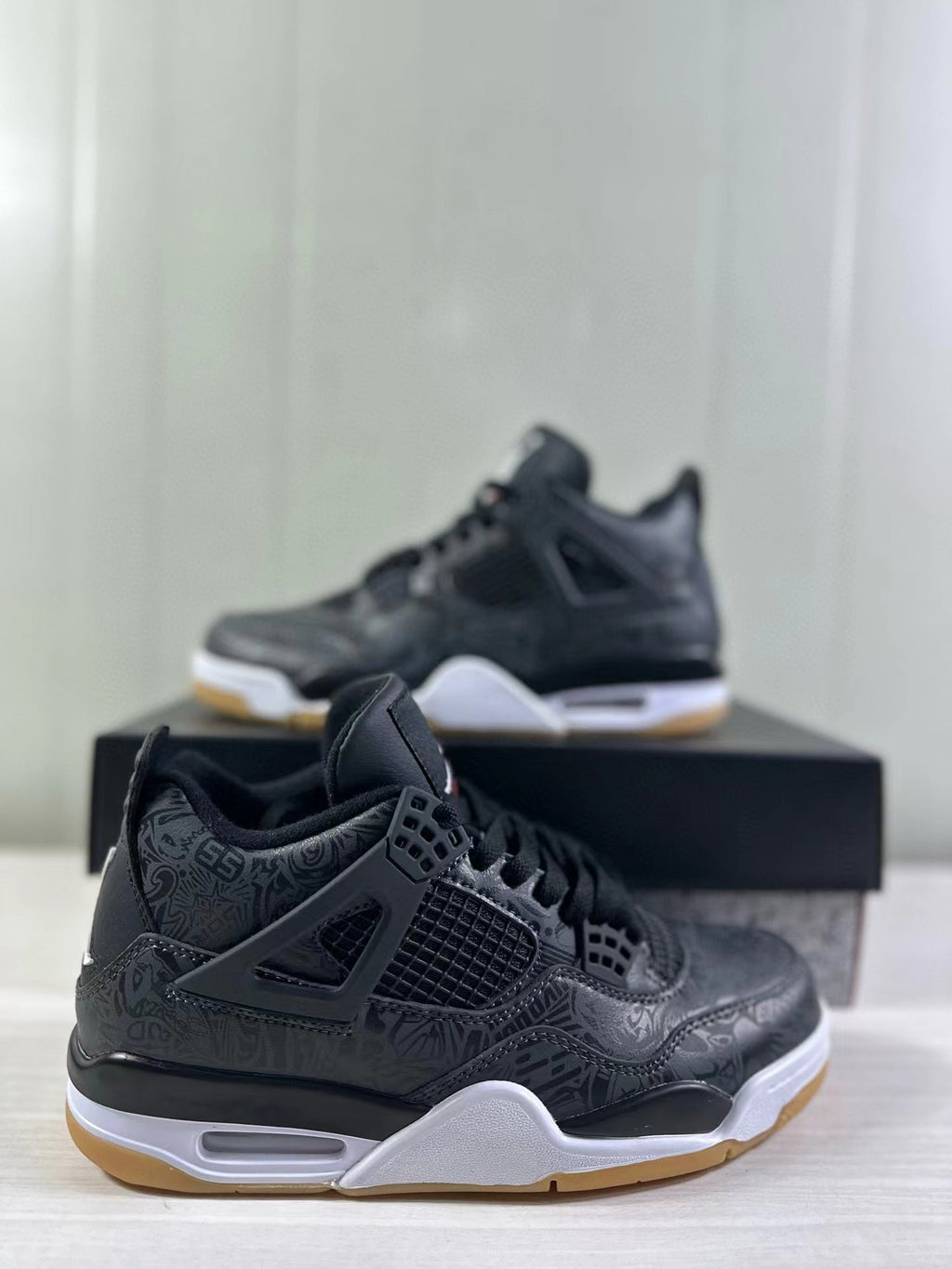 Air Jordan 4 Black Laser Sneakers CI2970-001 - product image from the listing.
