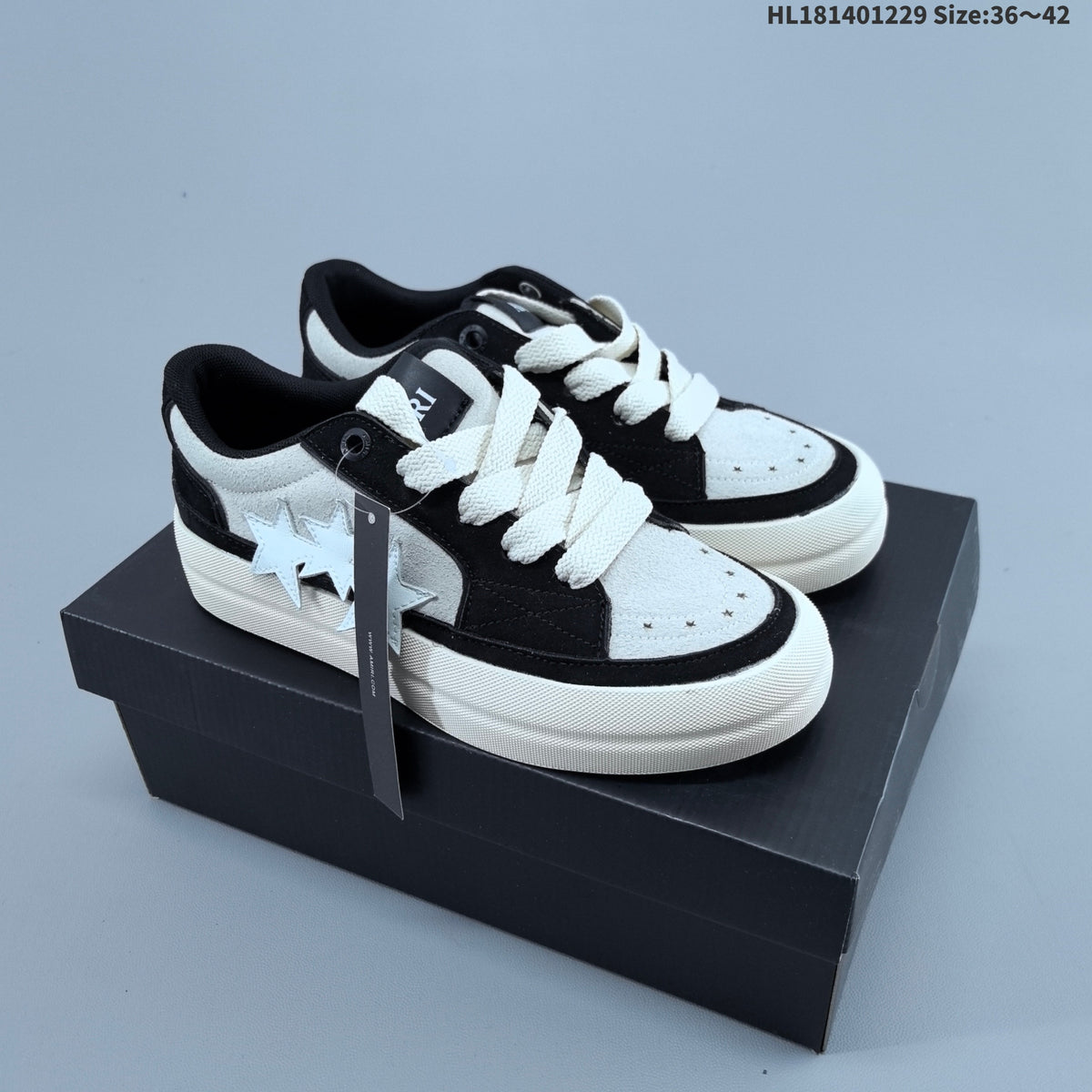 AMIRI Star Low-Cut Sneakers with Leopard Print Details - product image from the listing.