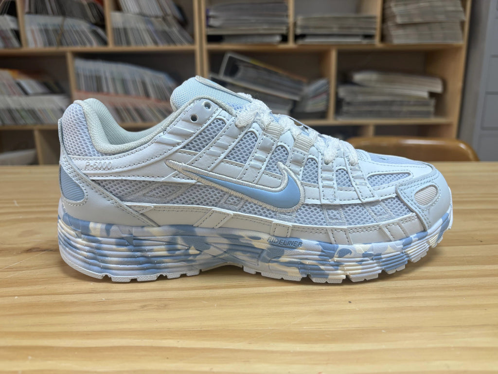 Nike P-6000 Sneakers in White and Blue CV2209-111 - product image from the listing.
