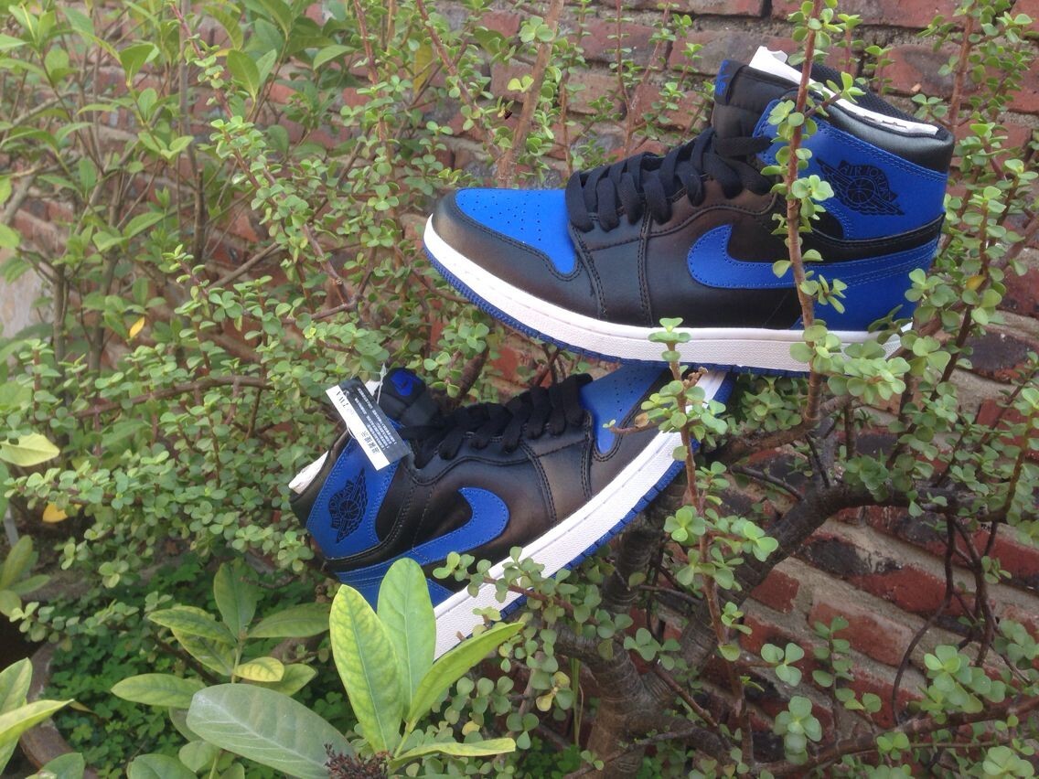 Jordan 1 High Basketball Sneakers in Blue and Black - product image from the listing.
