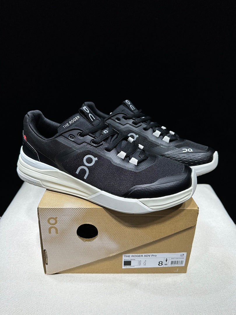 On THE ROGER Clubhouse Pro Tennis Sneakers in Black and White - product image from the listing.
