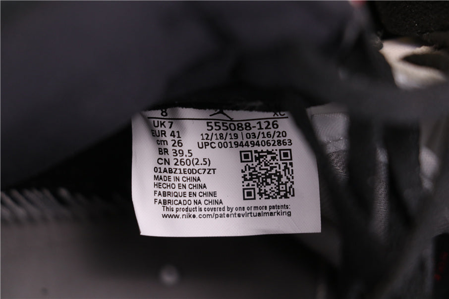 Air Jordan 1 High Sneakers in Light Smoke Grey 555088-126 - product image from the listing.