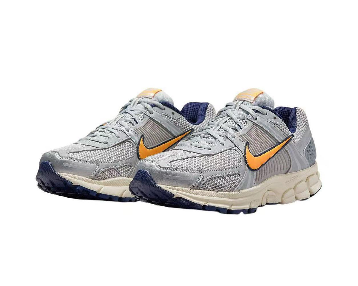Nike Zoom Vomero 5 Sneakers in Gray Orange - product image from the listing.
