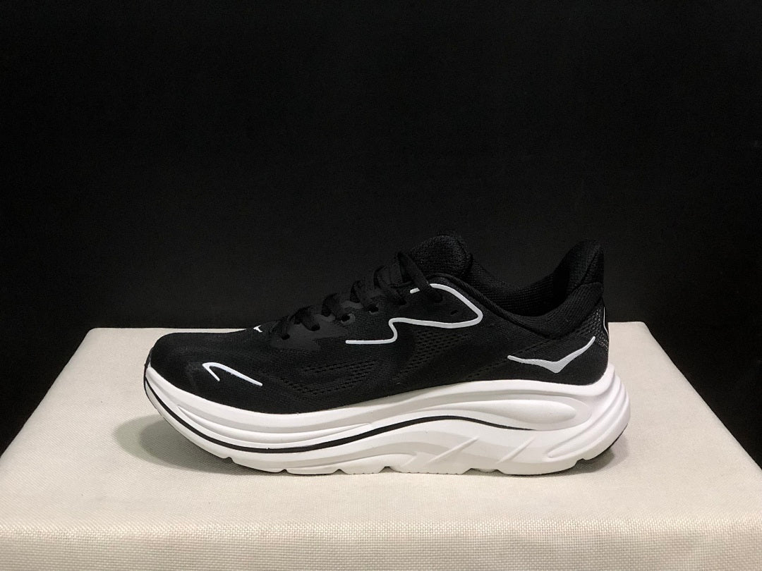 HOKA Clifton 10 Running Shoes in Black and White - product image from the listing.