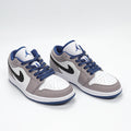 Jordan 1 Low Sneakers in White Grey Blue 553558-103 - product image from the listing.