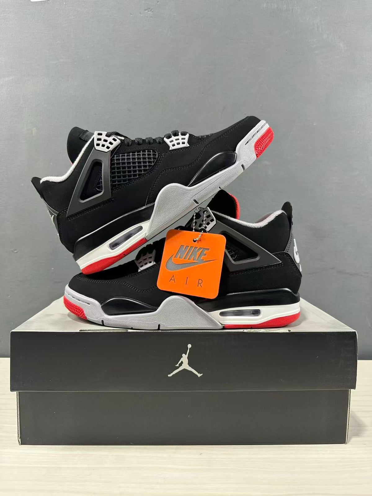 Air Jordan 4 Retro Bred Black Red Sneakers IX8180-001 - product image from the listing.