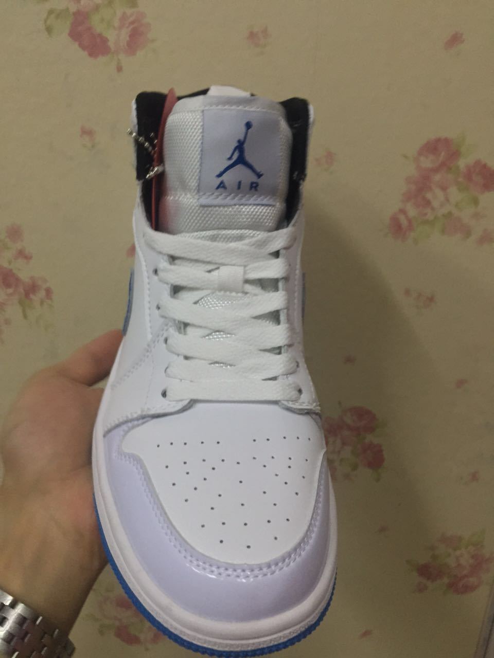 Air Jordan 1 High White and Royal Blue Sneakers - product image from the listing.