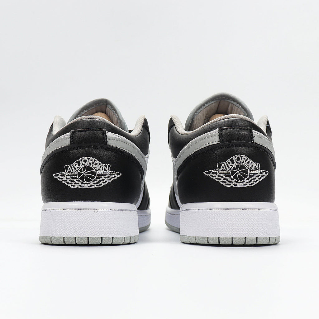Jordan 1 Low Sneakers in Cool Grey 553560-039 - product image from the listing.