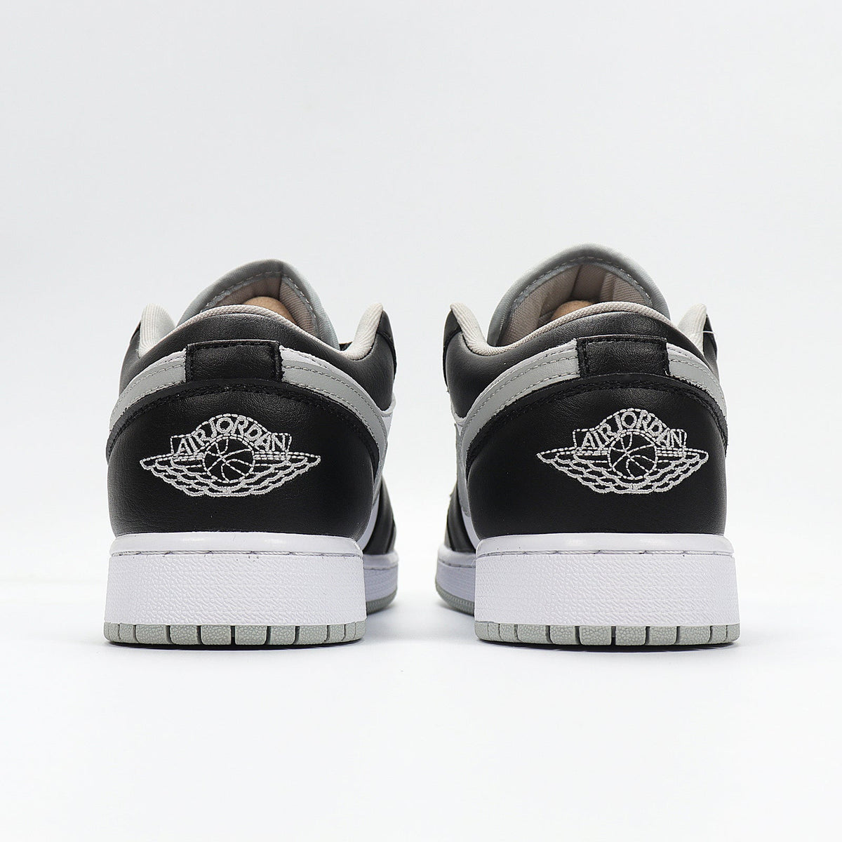 Jordan 1 Low Sneakers in Cool Grey 553560-039 - product image from the listing.