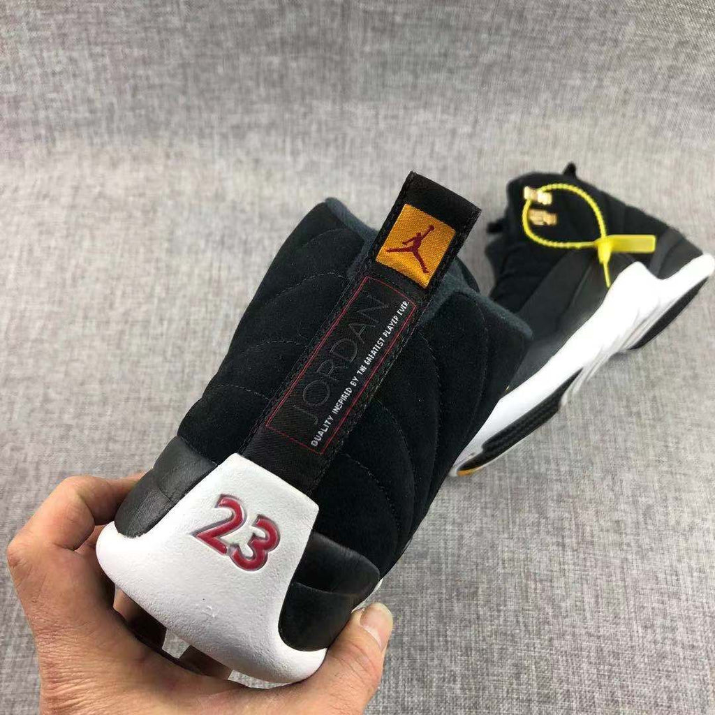 Air Jordan 12 Black Gold Sneakers 130690-017 - product image from the listing.