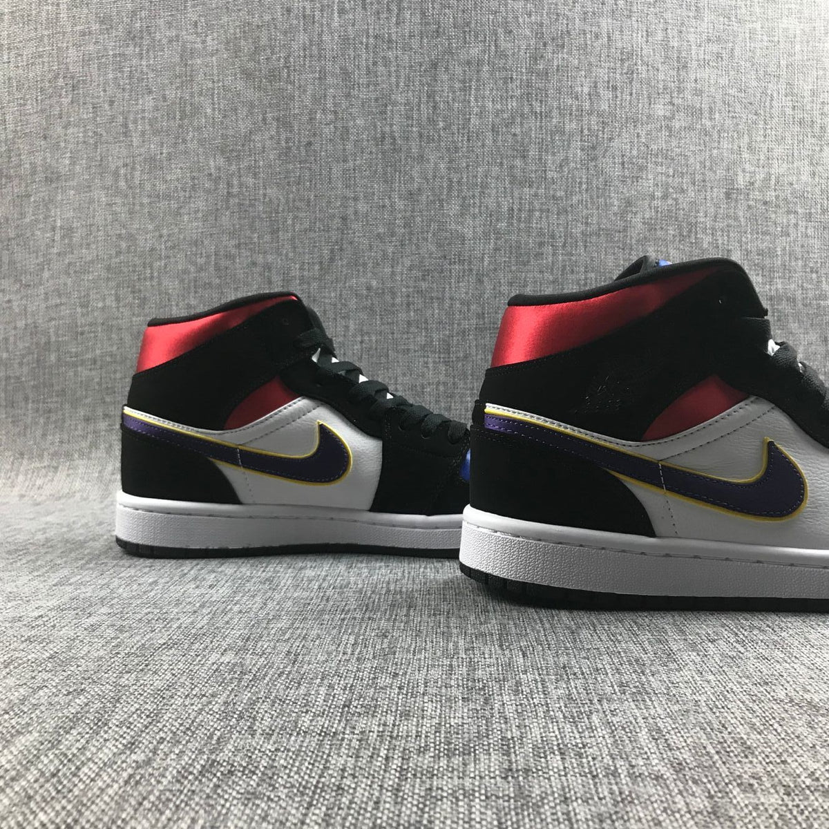 Air Jordan 1 Mid SE Sneakers in Black Purple Yellow 852542-005 - product image from the listing.