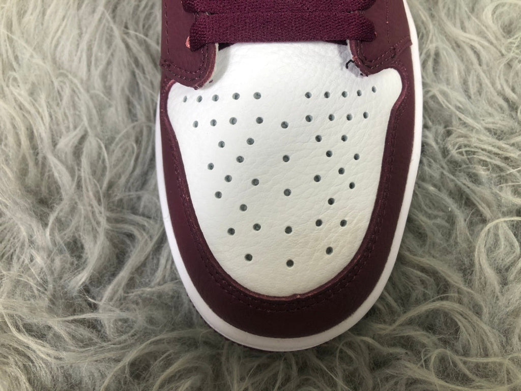Nike Air Jordan 1 Retro High OG Sneakers in Bordeaux 555088-611 - product image from the listing.