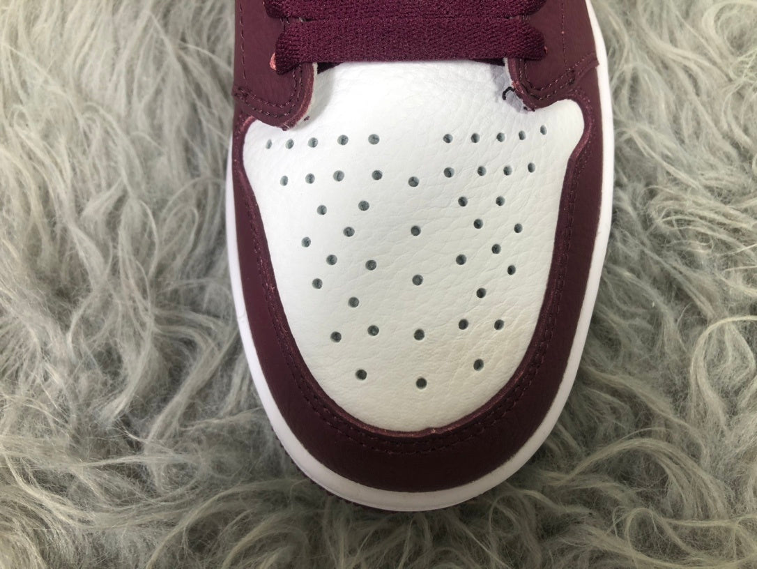 Nike Air Jordan 1 Retro High OG Sneakers in Bordeaux 555088-611 - product image from the listing.