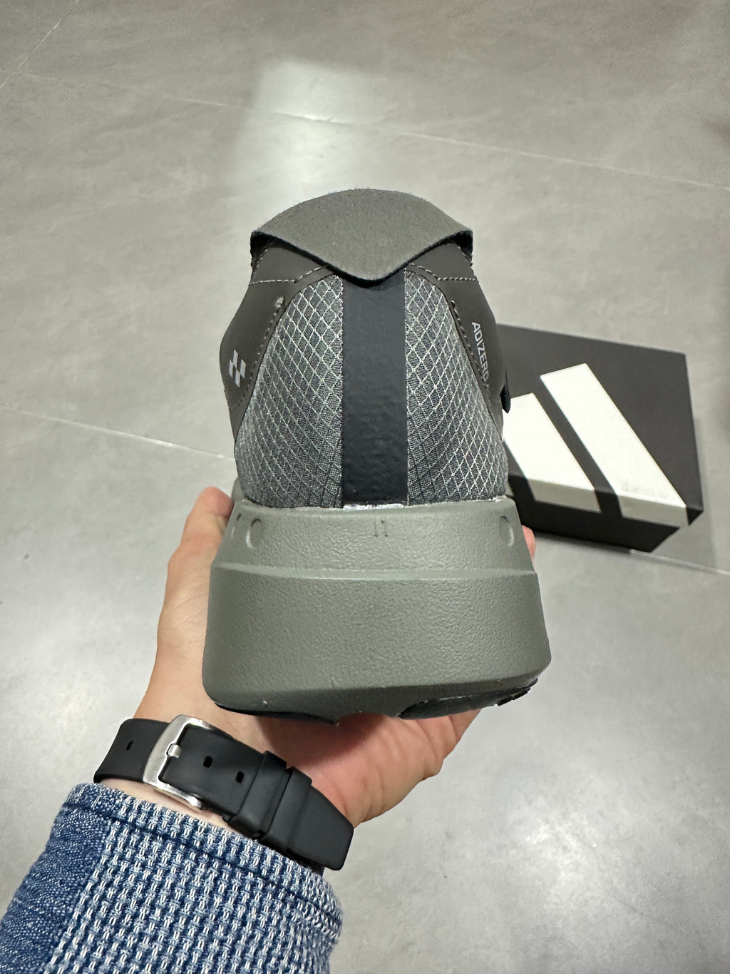 Adidas Adizero Adios Pro 4 Running Shoes in Grey Black - product image from the listing.
