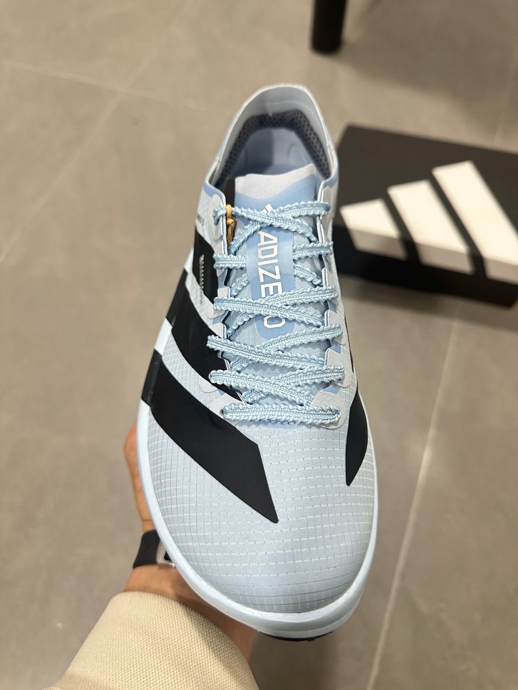 adidas Adizero Adios Pro Running Shoes, in Light Blue and Black - product image from the listing.