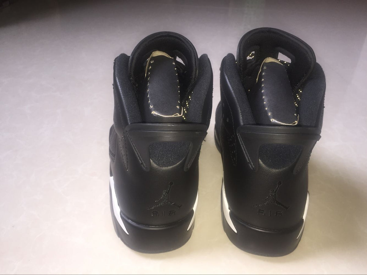 Jordan 6 Retro Black Cat High-Top Sneakers in Black and White - product image from the listing.