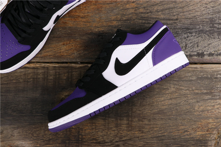 Air Jordan 1 Low Sneakers in White Black Orange Purple 553558-125 - product image from the listing.