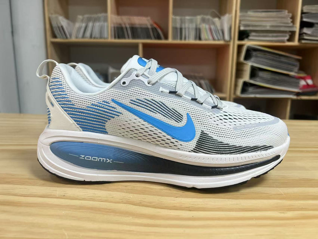 Nike Vomero 18 Running Shoes in White Blue - product image from the listing.