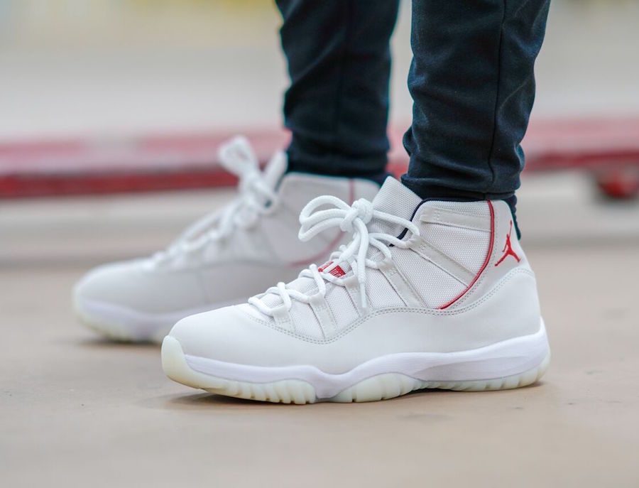 Air Jordan 11 Platinum Tint White High-Top Sneakers - product image from the listing.