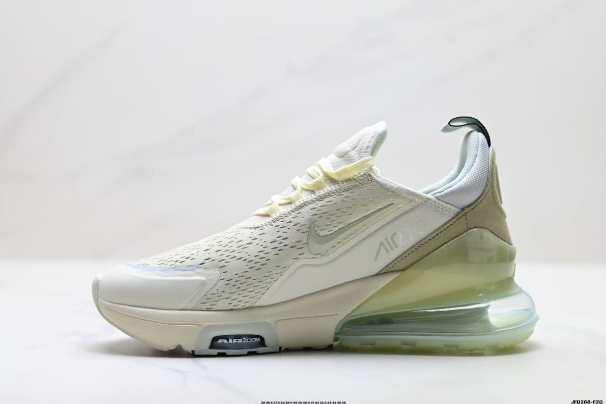 Light Green and White Nike Air Zoom Sneakers - product image from the listing.