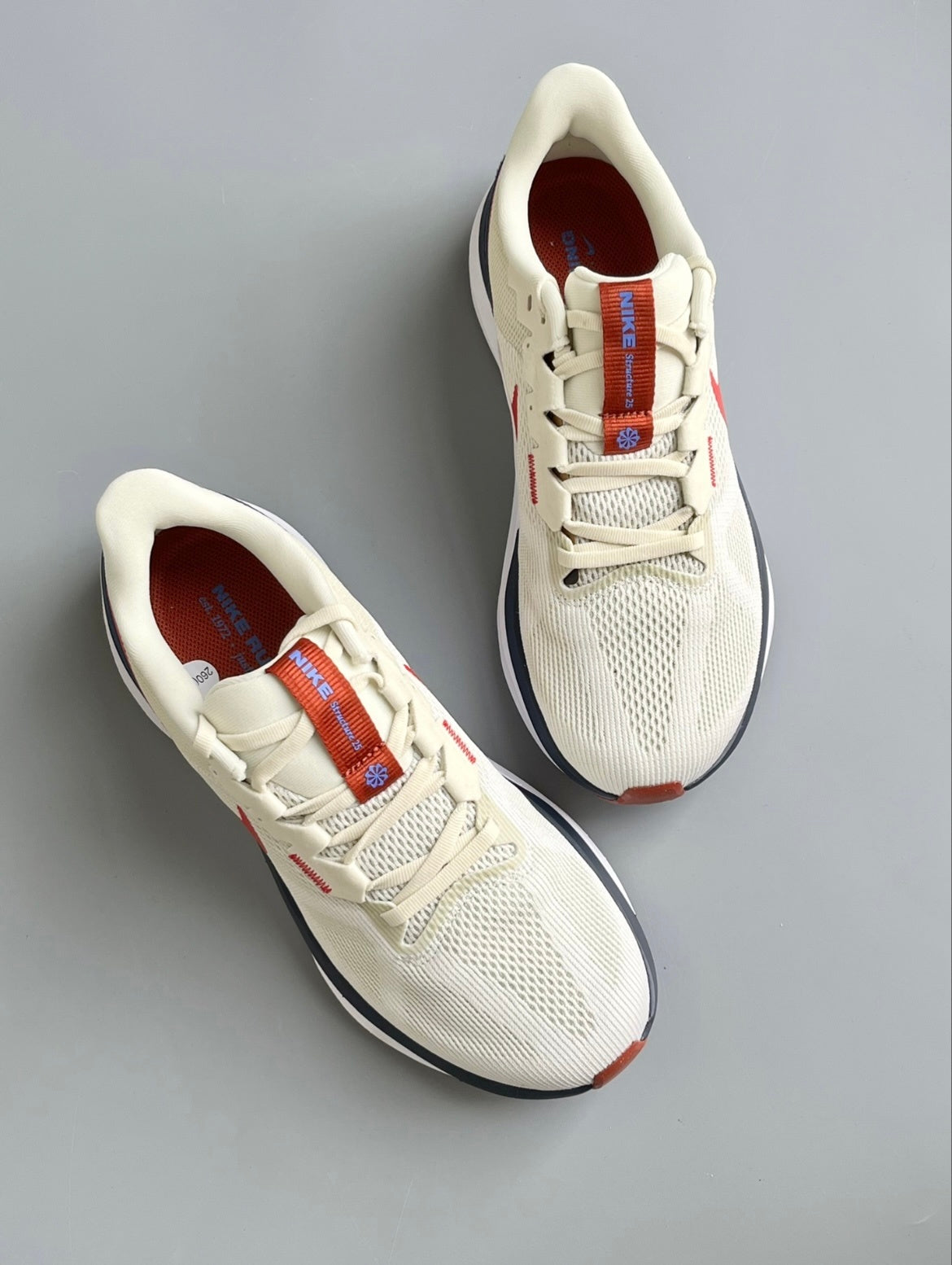 Nike Structure 25 Road Running Shoes, in Sail Red DJ7883-001 - product image from the listing.