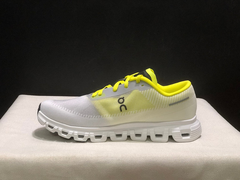 On Cloud 6 Push Sneakers in White and Yellow - product image from the listing.