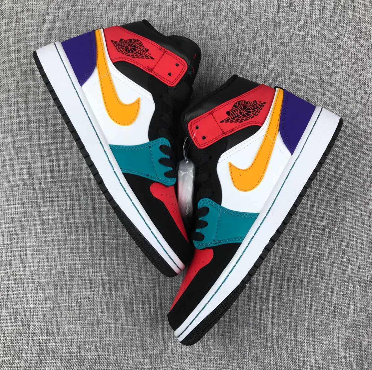Jordan 1 Mid High-Top Sneakers in Multicolor - product image from the listing.